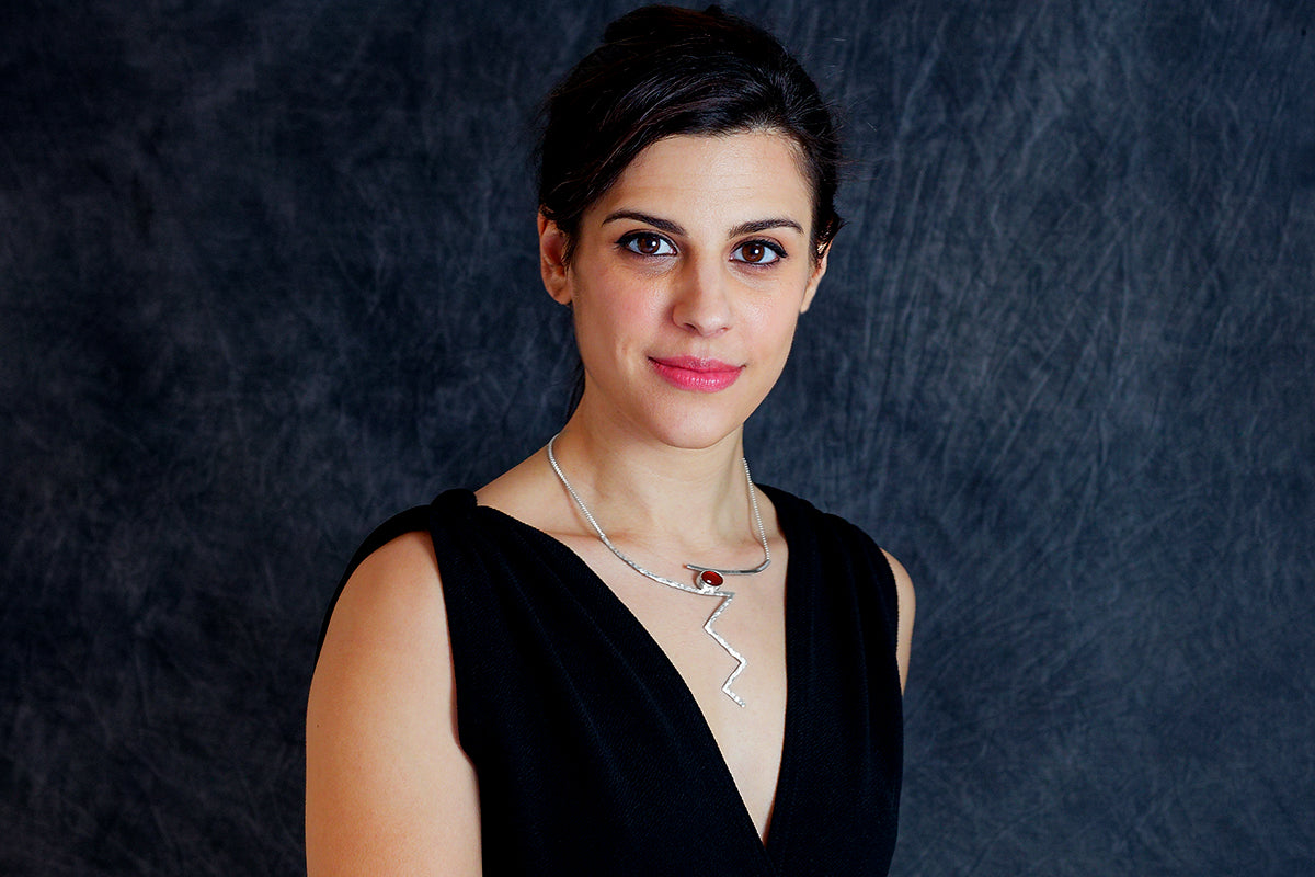 Woman wearing Adonis necklace by Rouaida.