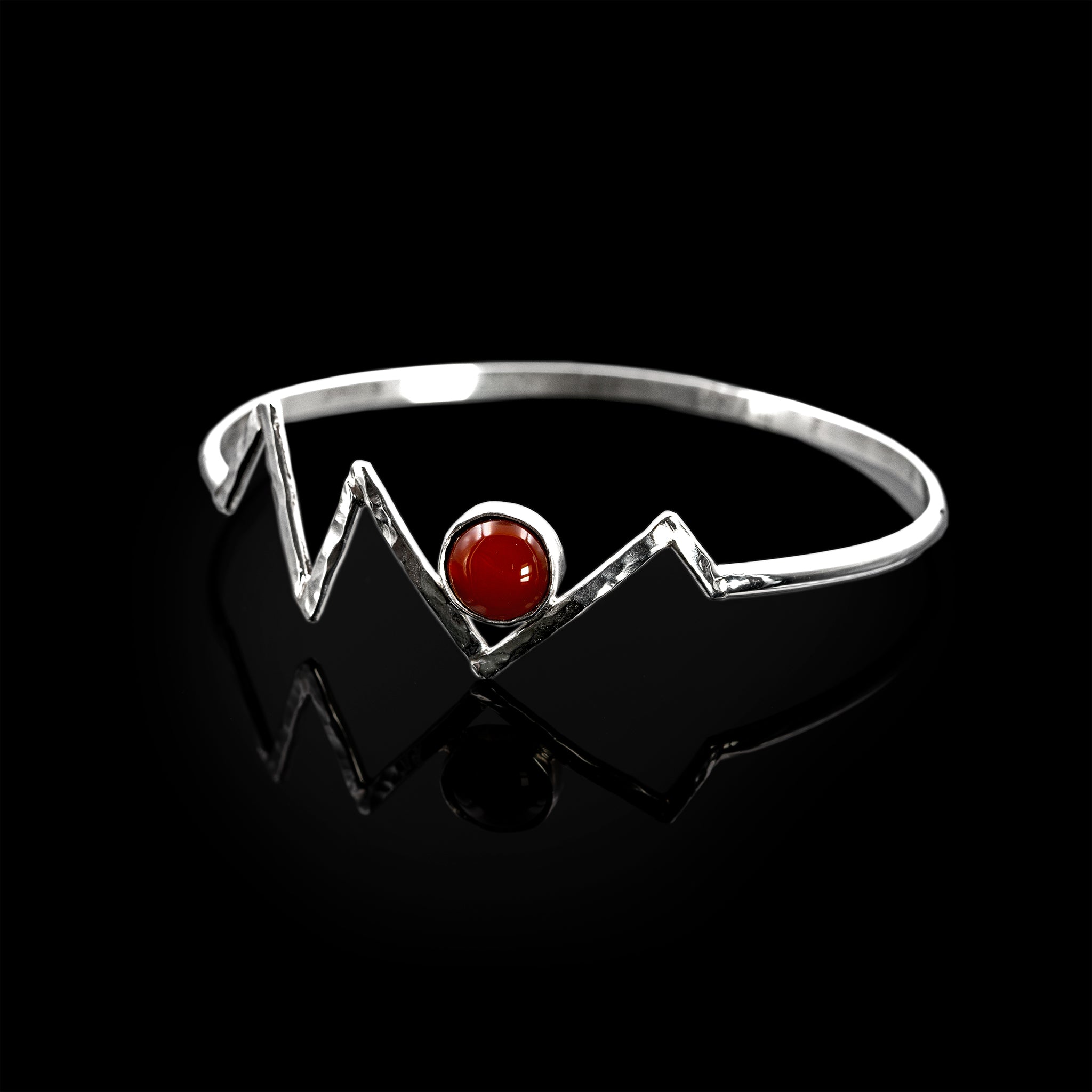 Silver Adonis bangle by Rouaida with carnelian stone.