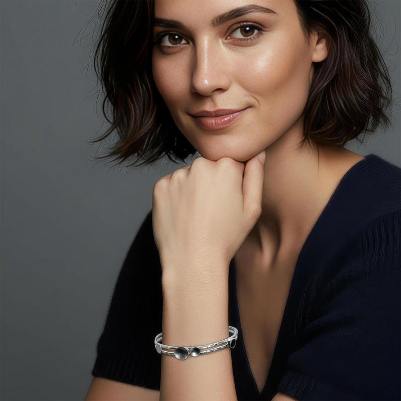 Illustration showing how the Constellation bangle looks when worn.