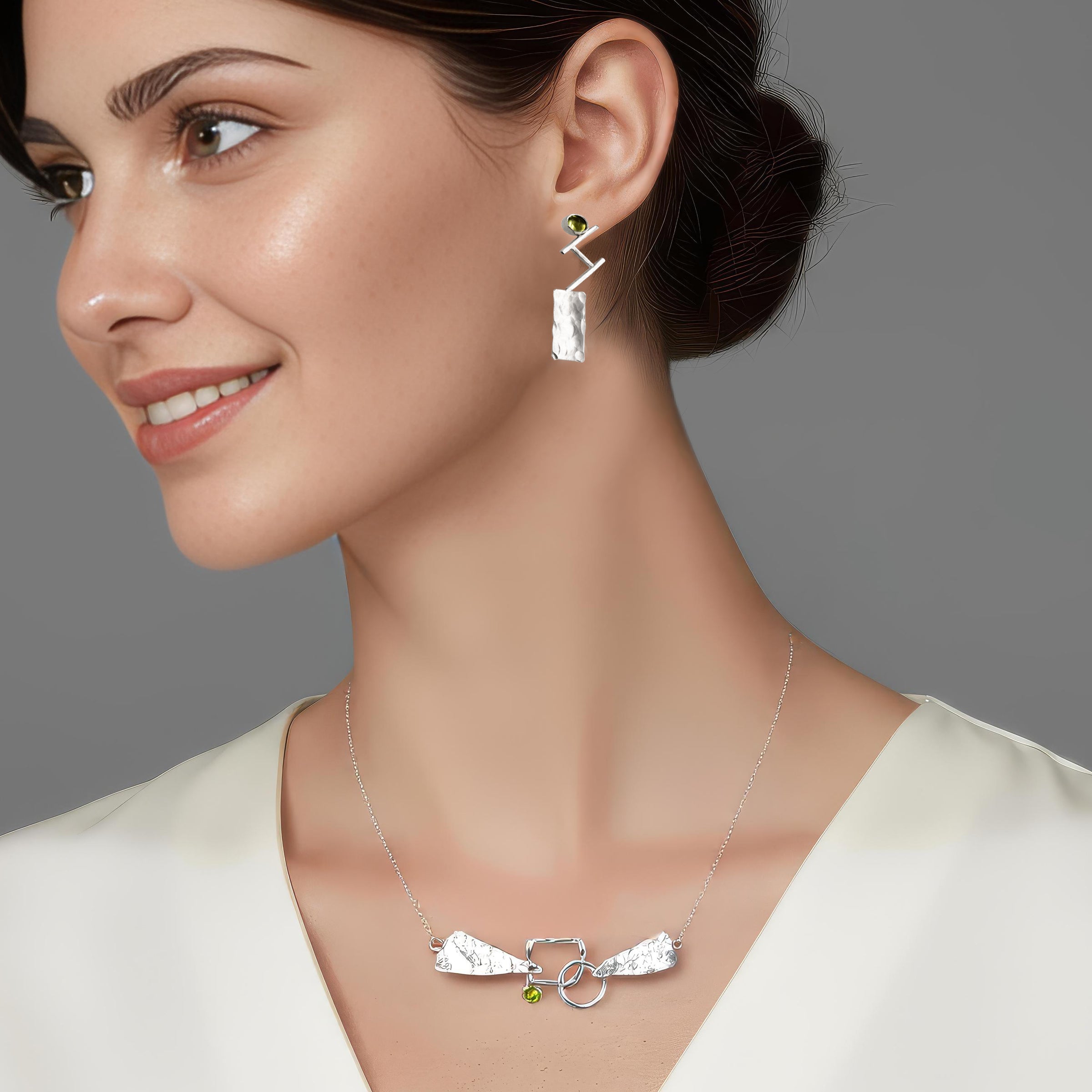 An illustration of how our Discordant necklace and Discordant earrings look when worn together.