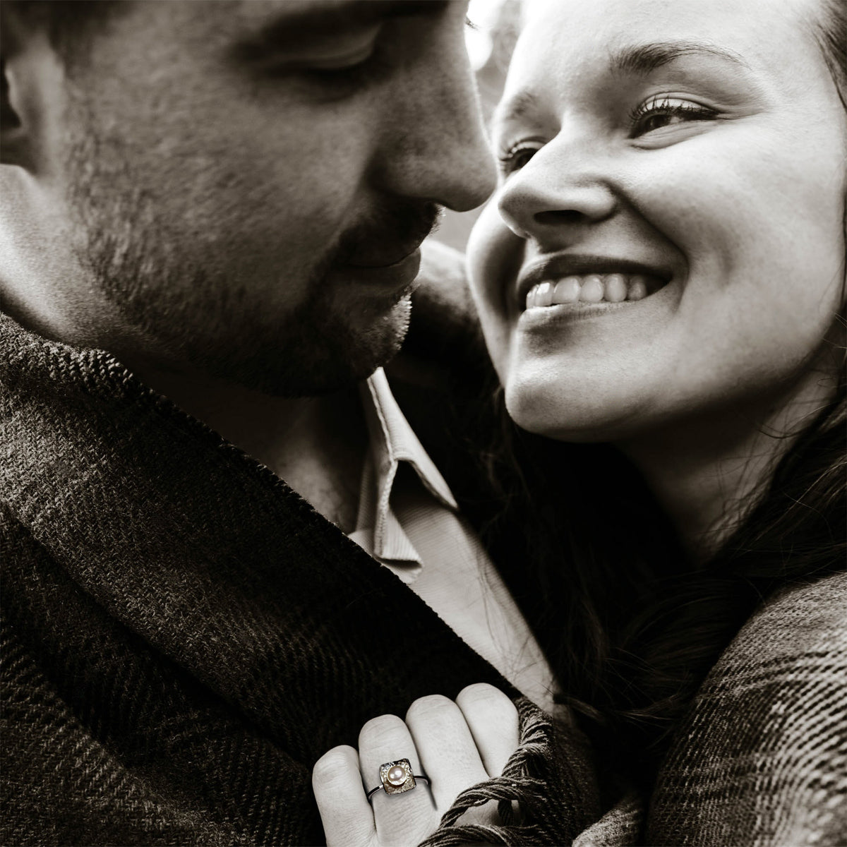 Loving couple with Treasure Trove ring by Rouaida.