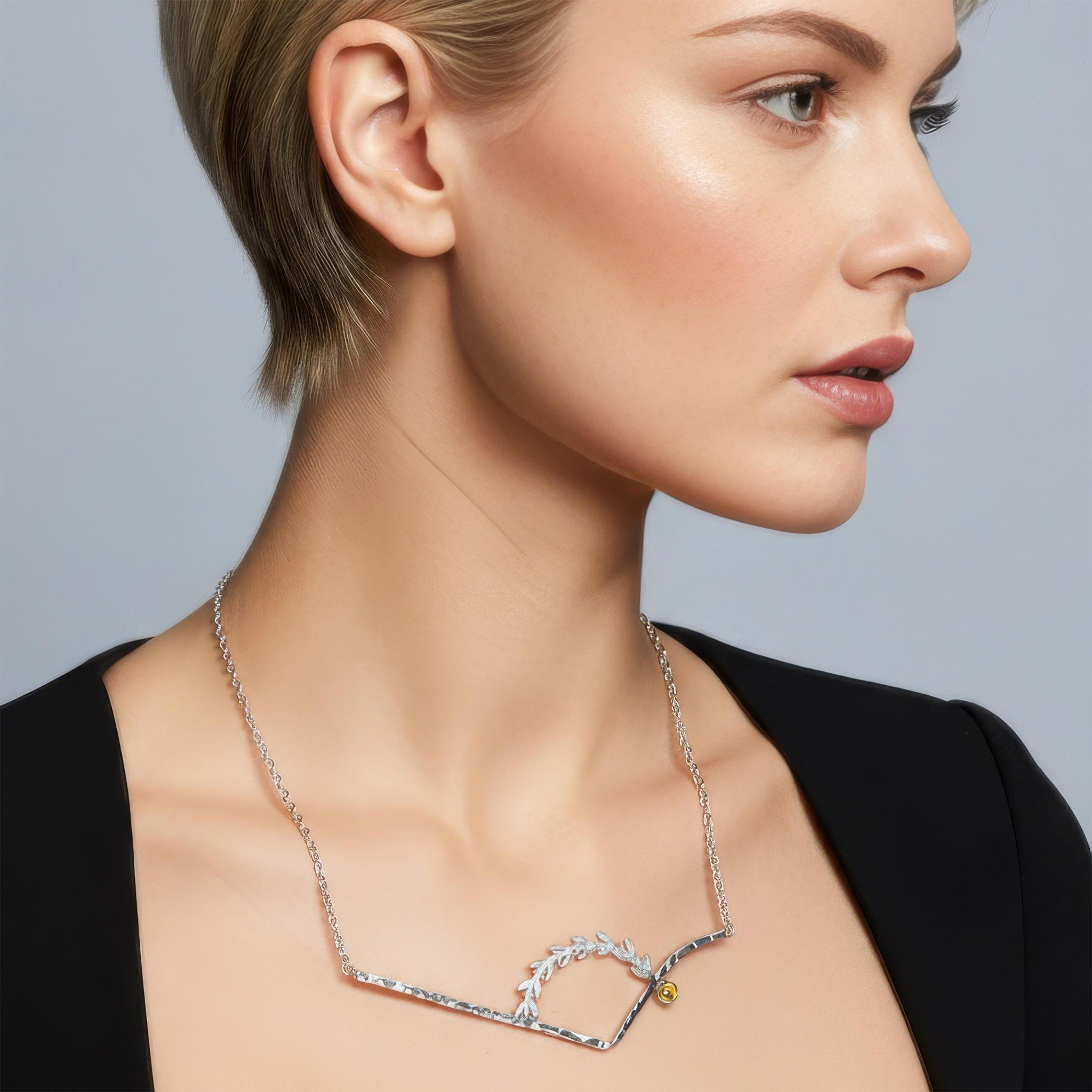 An illustration of how our Hero necklace looks when worn.