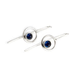 Abyss earrings by Rouaida on white background.