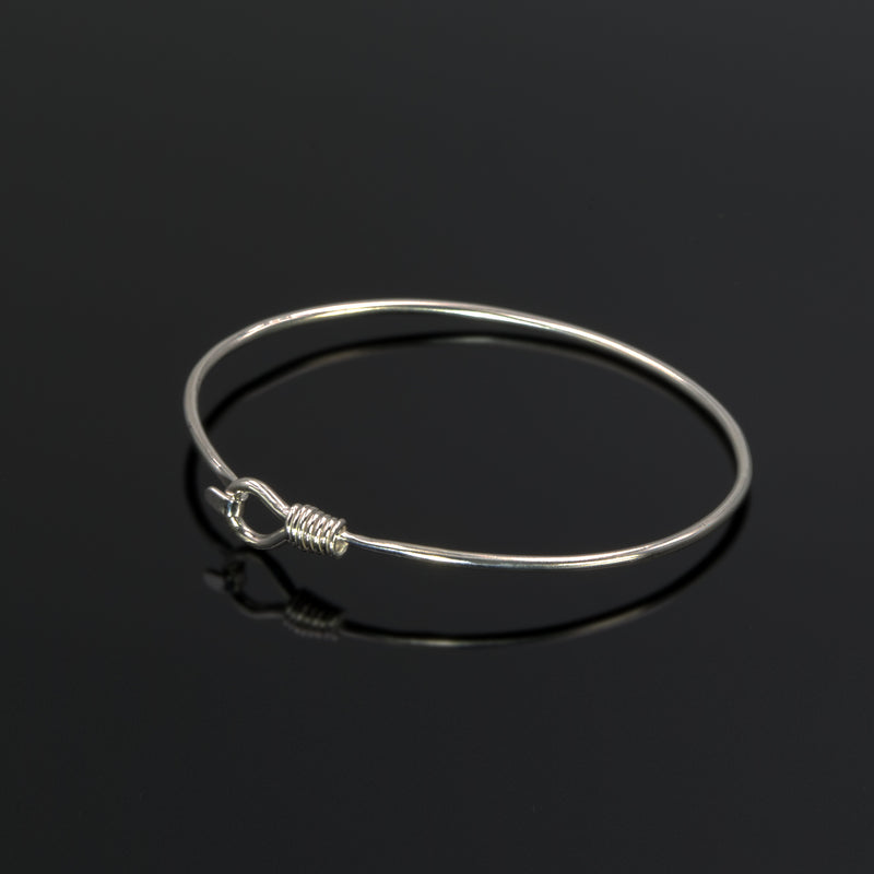 Alpha bangle in sterling silver by Rouaida.