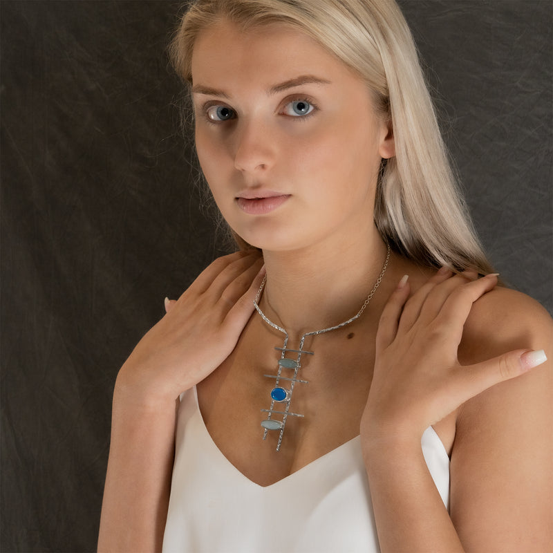Model wearing Byblos necklace by Rouaida.
