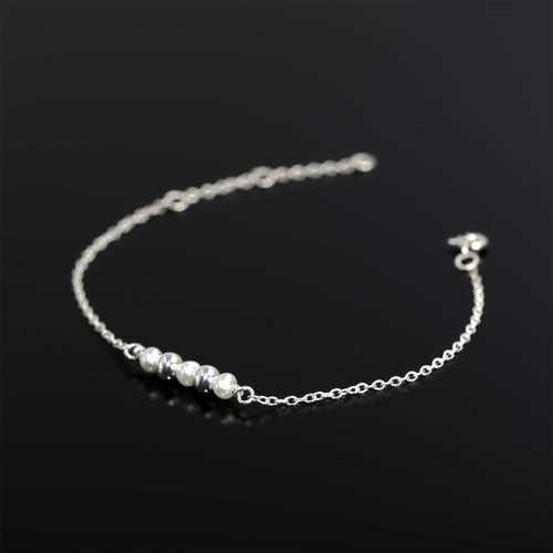 Sterling silver Celestial bracelet with freshwater pearls by Rouaida.