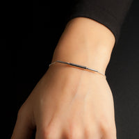 Sterling silver Concentric bracelet by Rouaida on model's wrist.
