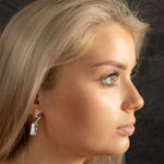 Model wearing Discordant earrings by Rouaida.