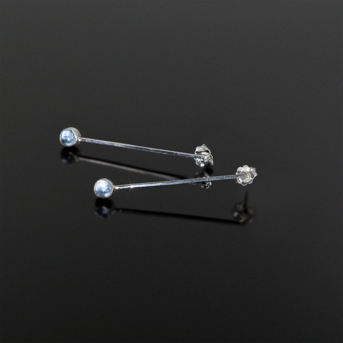 Drop in the Ocean earrings with aquamarine stones by Rouaida.