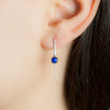 Model wearing sterling silver Echo earrings by Rouaida.