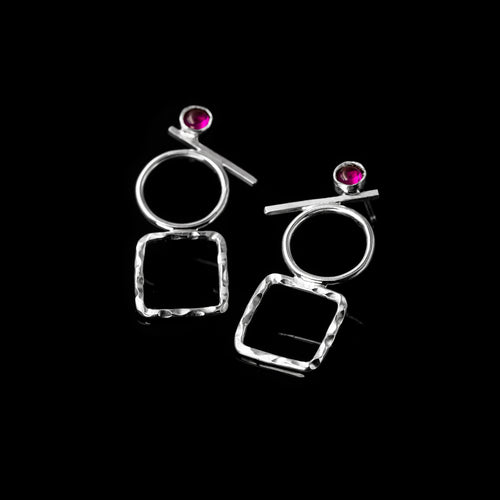 Silver Fulcrum earrings by Rouaida with ruby stones.