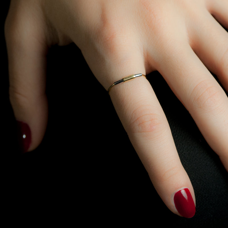 Concentric ring in sterling silver and 18ct gold on model's hand