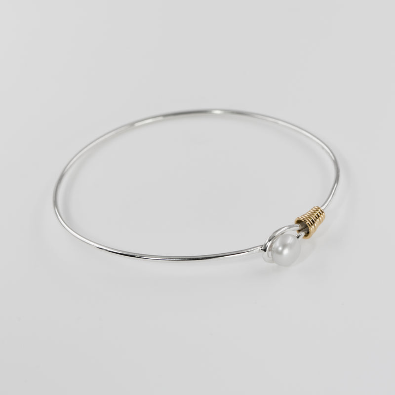 Grace bangle by Rouaida with gold and pearl accents.