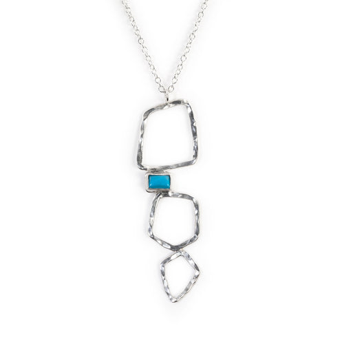 Silver Paradox necklace by Rouaida with turquoise stone.