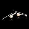 Sterling silver earrings with freshwater pearl accents by Rouaida.