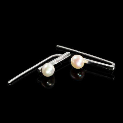 Sterling silver earrings with freshwater pearl accents by Rouaida.