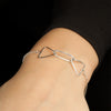 Quantum chain bracelet on model's wrist.