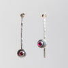 Topsy Turvy earrings in sterling silver with ruby stones by Rouaida.