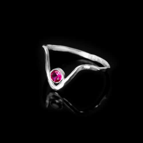 Silver victory ring by Rouaida with ruby stone.